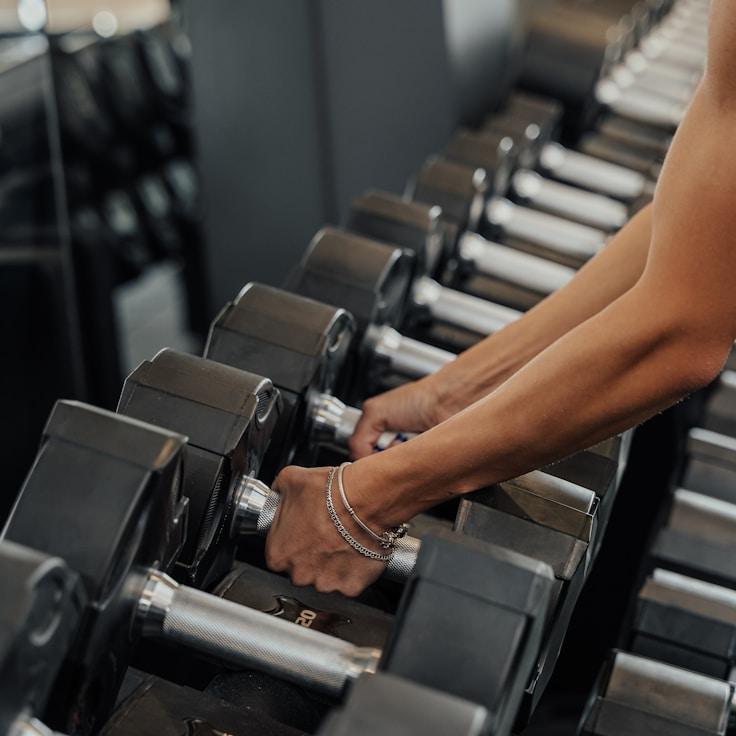Interior of a professional gym with weight training equipment and mirrors